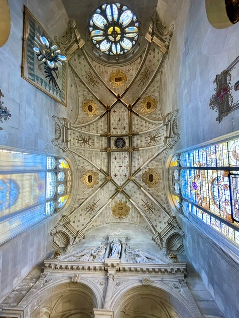 Chapel Ceiling and stained glass with reflected light at Chantilly Chateau in France