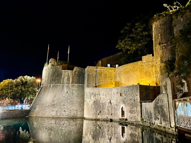 Walls lit up at night in Historic Old Town of Kotor, Montenegro