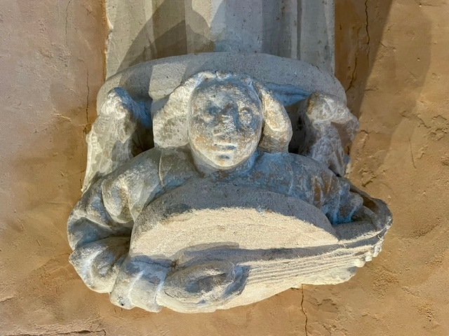 Roof finial of an angel playing an instrument, in the Museum of Art and Archeology in Senlis, France